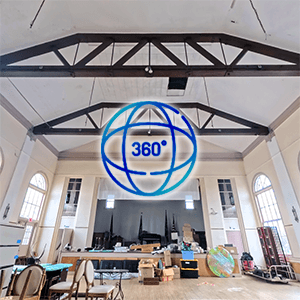A 360-degree view of a banquet hall providing full layout and ceiling condition.